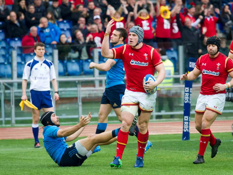 Davies celebrates his try which sparked the Dragons into life