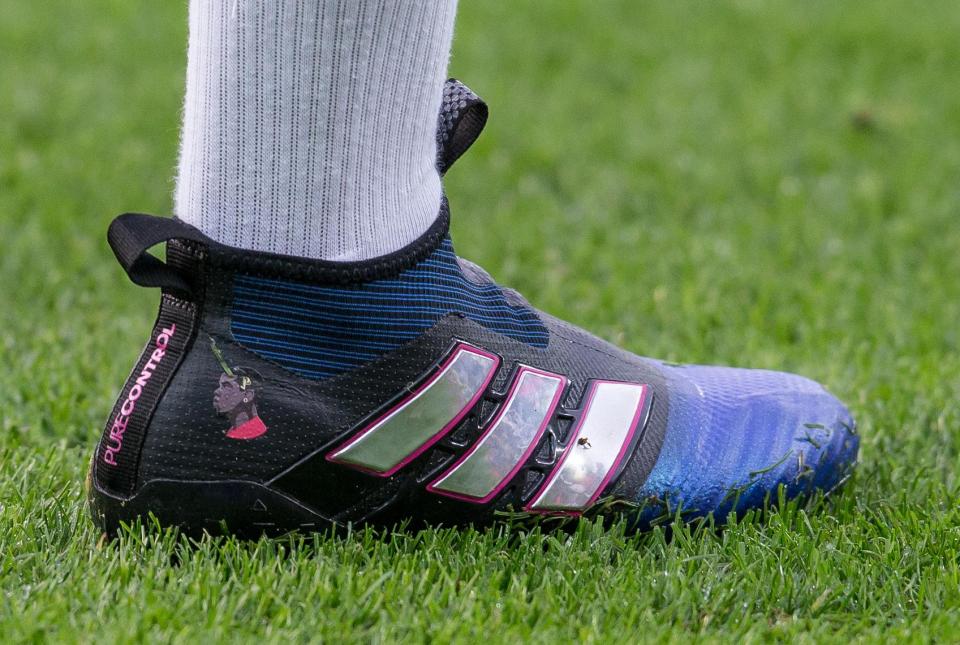 Paul Pogba continued his one-man publicity campaign by wearing boots with a picture of himself on it