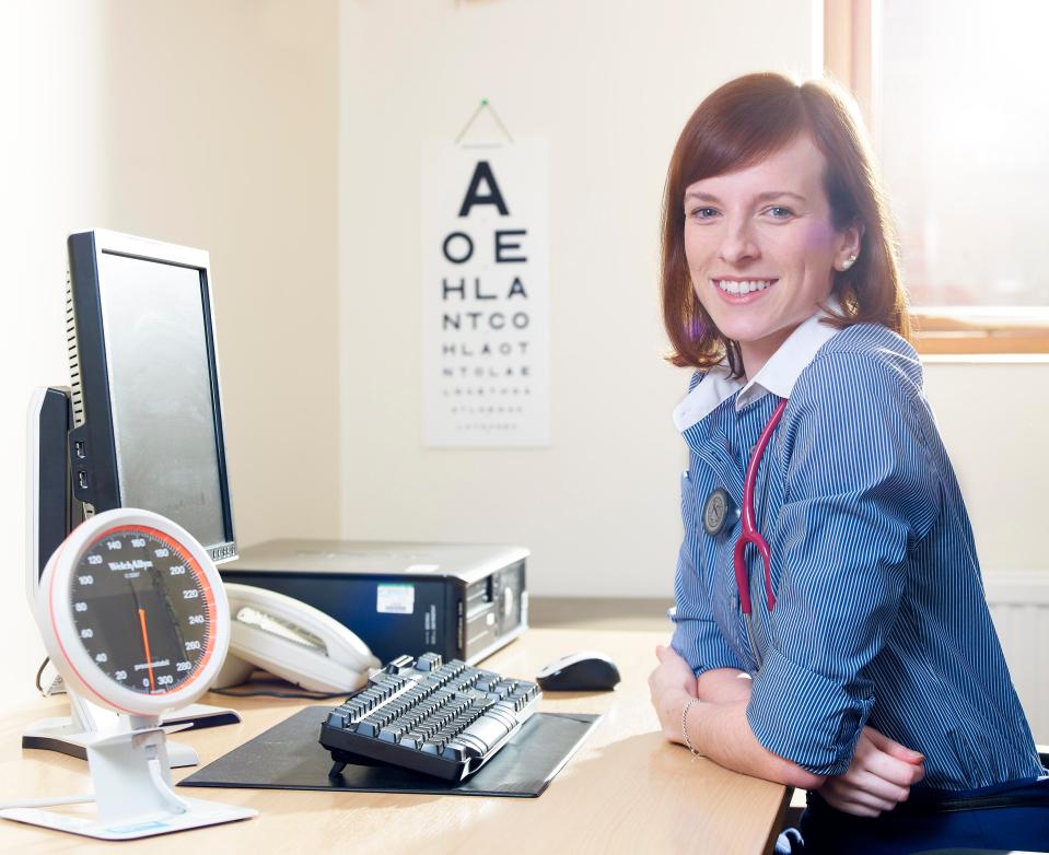  Theresa May has blamed short opening hours at GP surgeries for the strain on the NHS