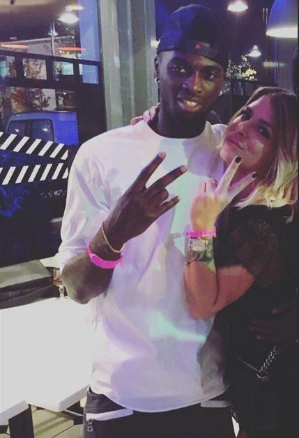 M'Baye Niang poses for a picture with his girlfriend during a night out together