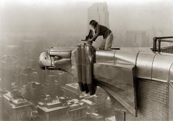  Life photographer Margaret Bourke-White taking a photo while balancing precariously from the Chrysler Building