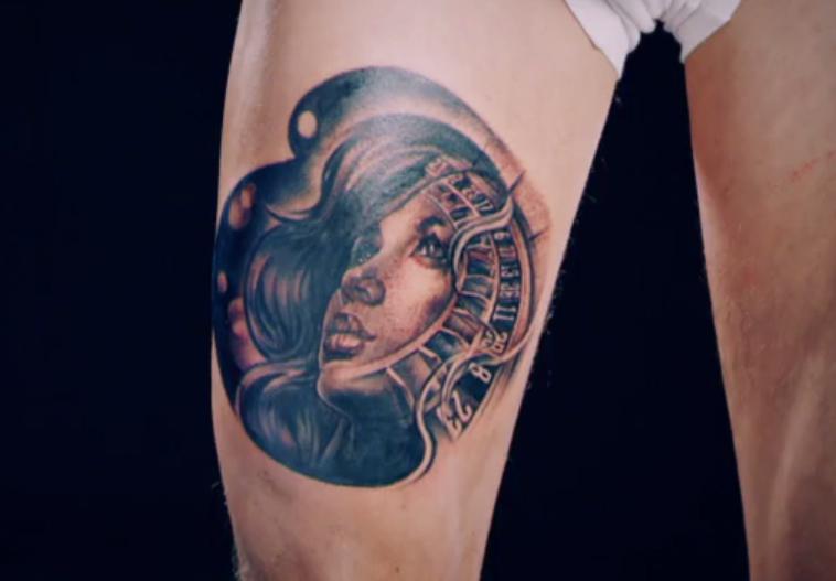  Adam had a 'pin up' girl and roulette wheel  on his leg