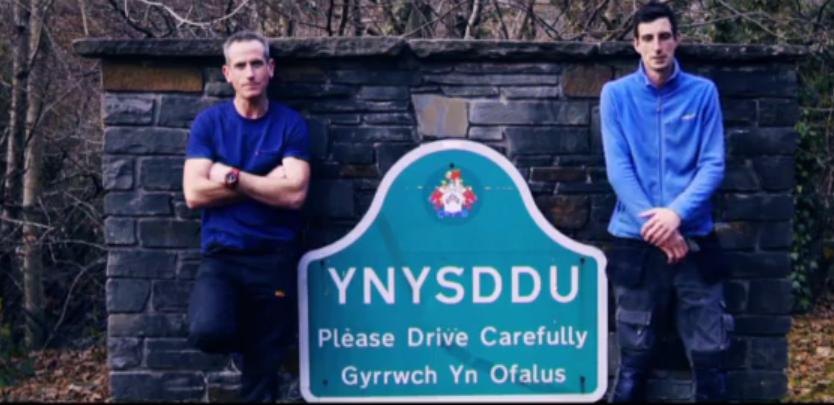  The lads pose with their local village sign in Wales