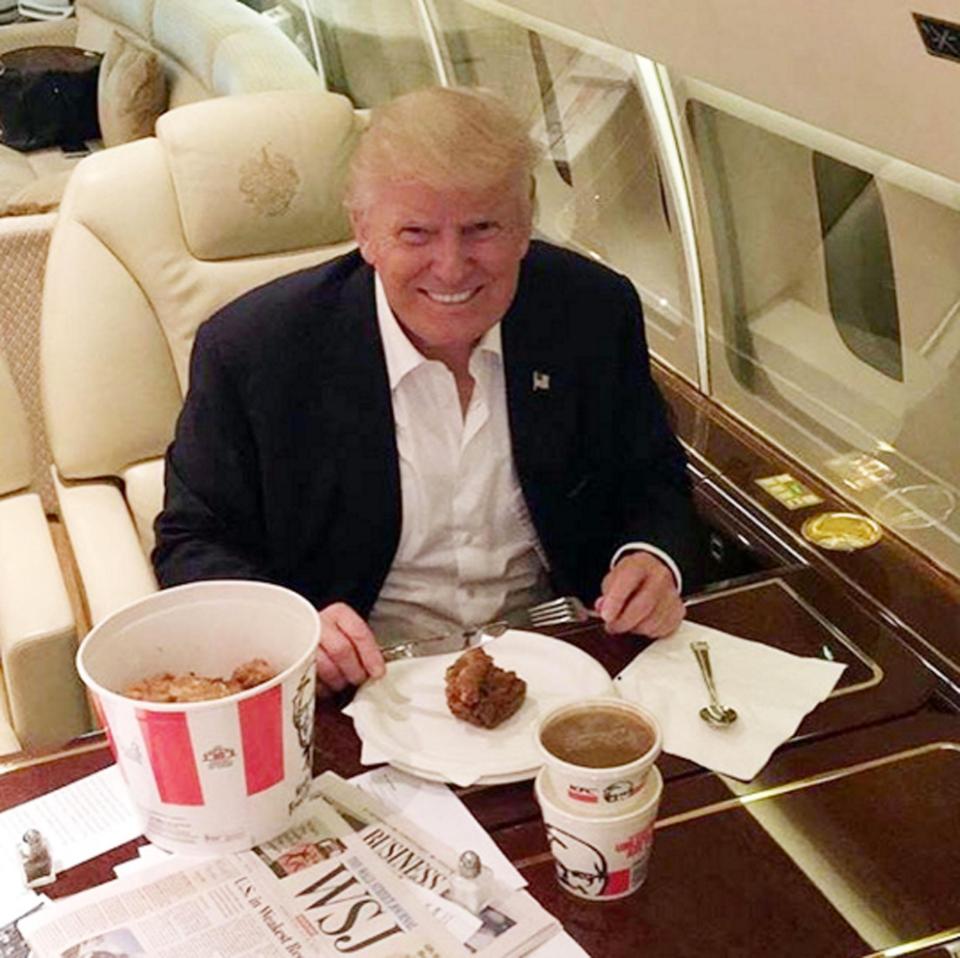  Donald Trump looking as happy as Larry with his KFC