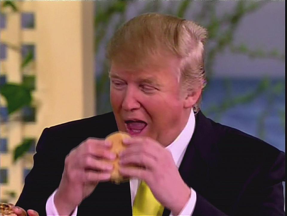  Lovin' it...Donald Trump chomps a McDonald's burger