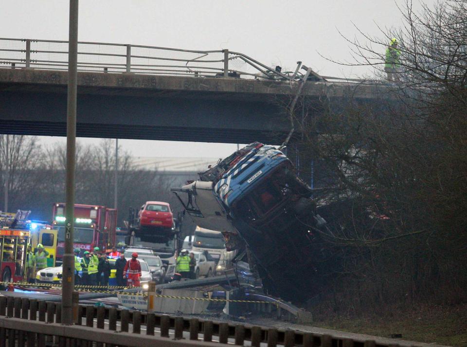  The lorry crashed through the barrier of a bridge on to the dual carriageway below yesterday