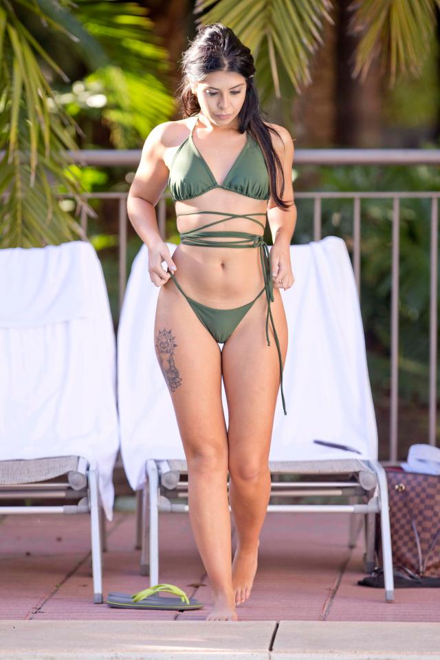  Cara showed off her sensational figure in a khaki green bikini