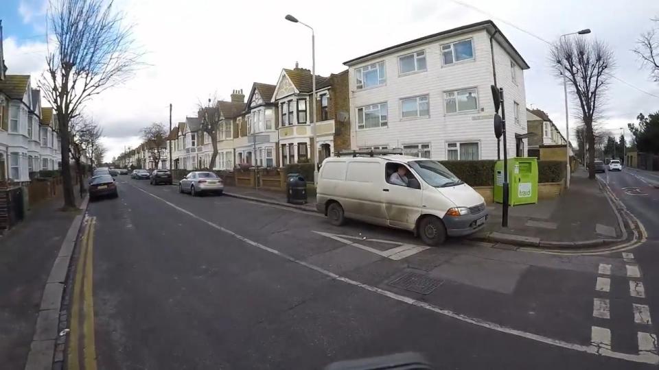  The cyclist spots the trash outside the van