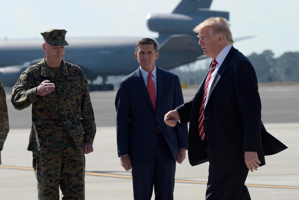  Gen. Dunford, left, greets President Trump alongside now-former National Security Adviser Michael Flynn