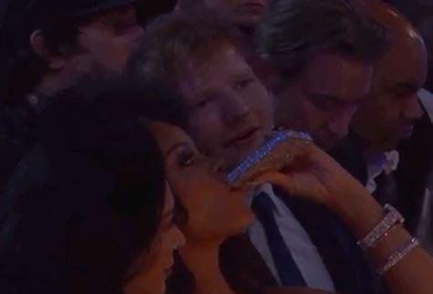  Ed Sheeran looks on as Rihanna downs a shot from a jewelled hip flask