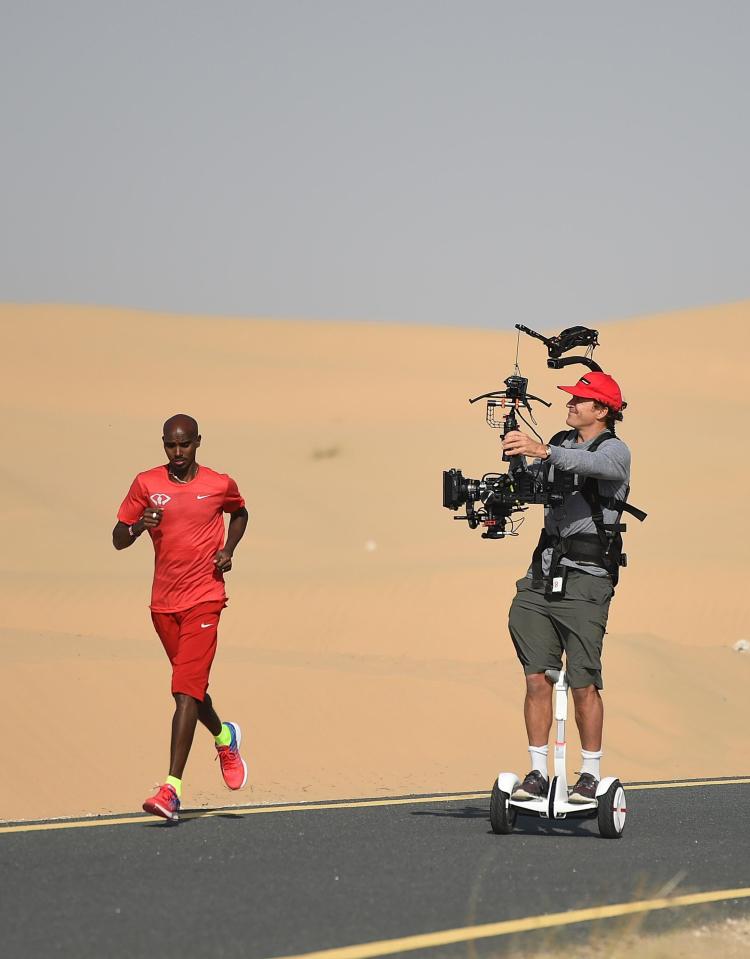 Mo Farah is followed by a cameraman as he trains in Dubai