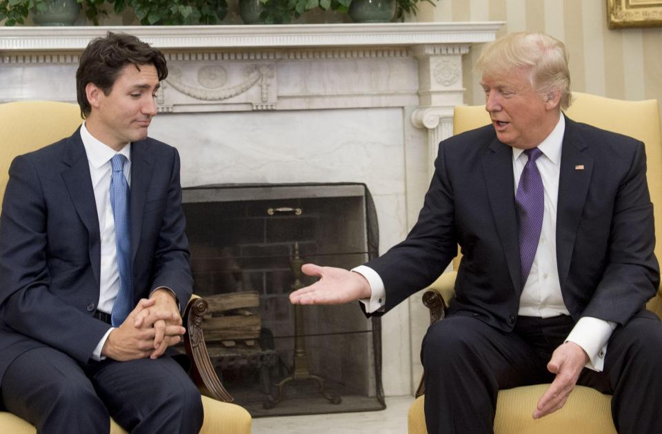  Theresa May was criticised by the left for her response to Trump's travel ban... but less than a month later Canadian PM Justin Trudeau cosied up to the US President