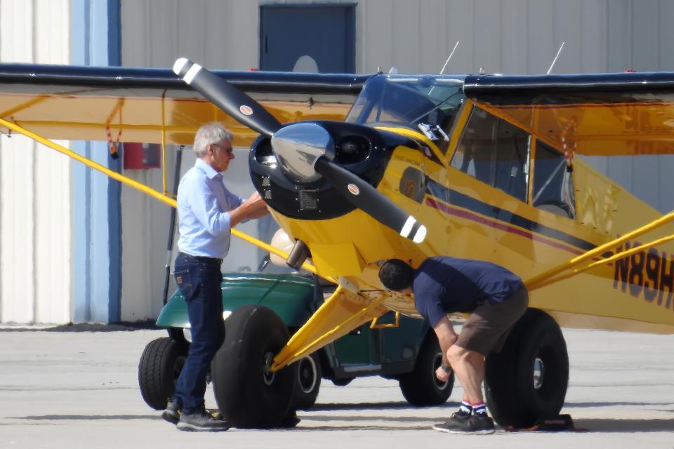  The movie star was spotted inspecting his aircraft before take-off