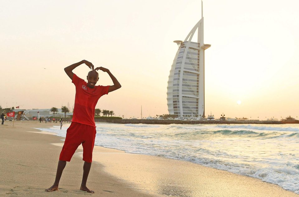 Mo Farah performs the Mobot in front of the Burj Al Arab Jumeirah