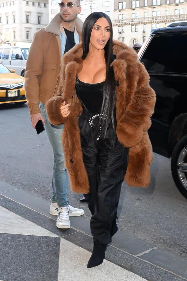  Kim Kardashian stepped out in a fur coat Thursday after Sia asked her husband to stop using it in his fashion line