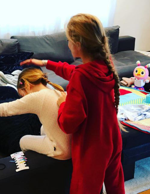  Peter recently shared this cute picture of elder daughter Princess doing younger daughter Amelia's hair