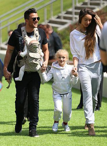  Peter with Princess and wife Emily Macdonagh as he carries his new baby Theo