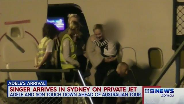  The singer looked happy as she left her private plane in Australia