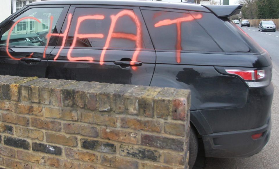  The pricey motor was pictured on a driveway in posh Richmond, London with the words "cheat" and "rot in hell"