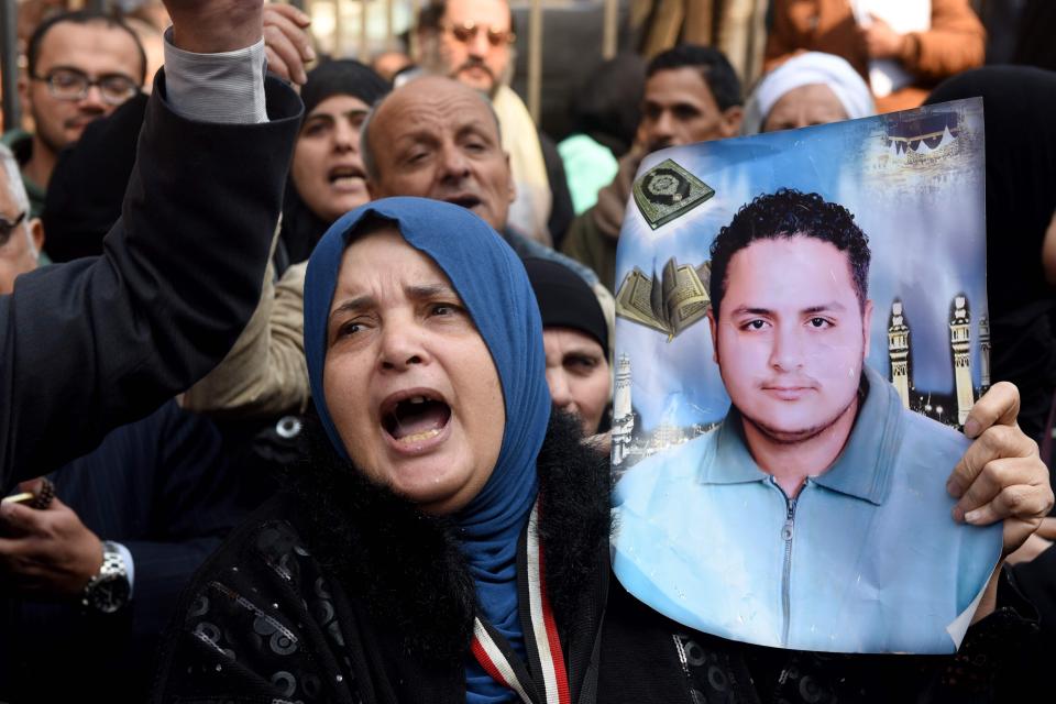  Egyptian family members of victims of the Port Said massacre react outside the Court of Cassation today