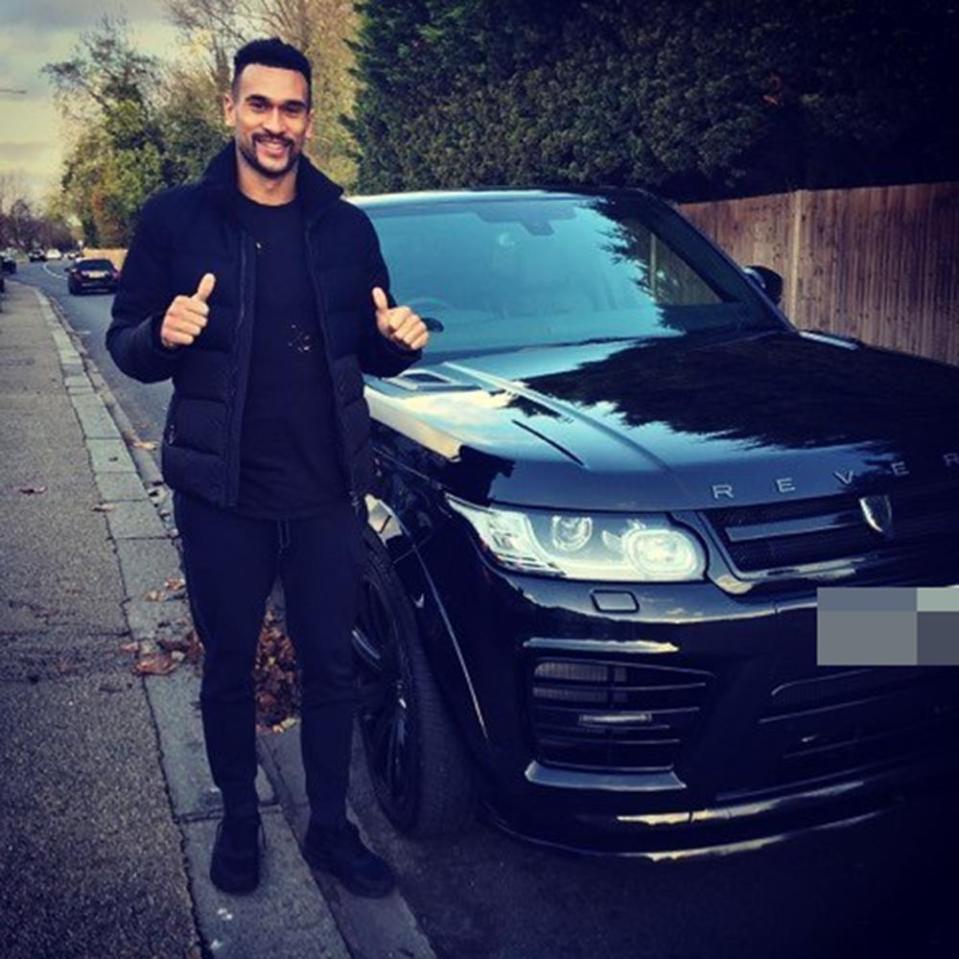  Caulker gives thumbs-up next to his then-new car