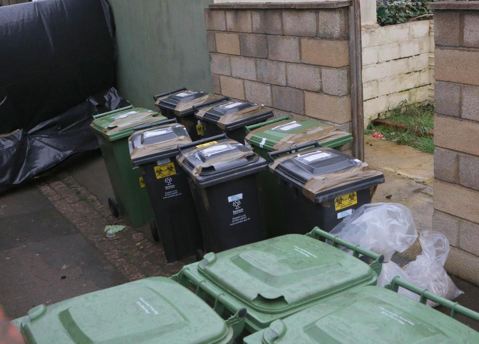 Several bins were seen outside the former home of Christopher Halliwell plastered with biohazard stickers