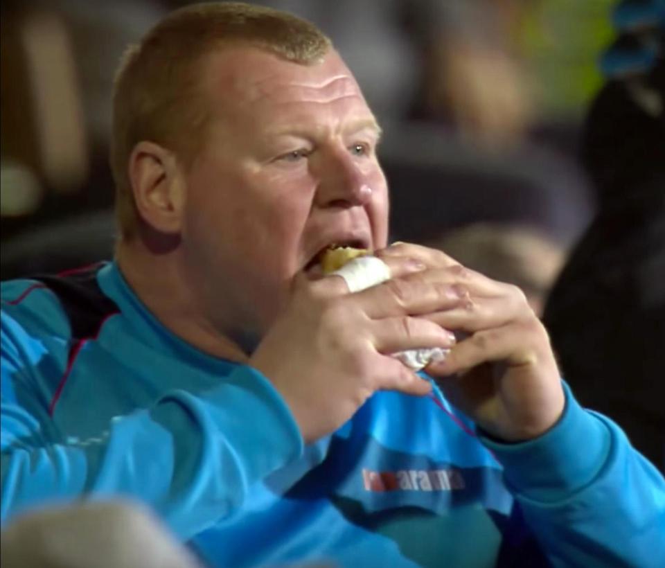  Sutton keeper Wayne Shaw chomped down on a pasty during their Arsenal match