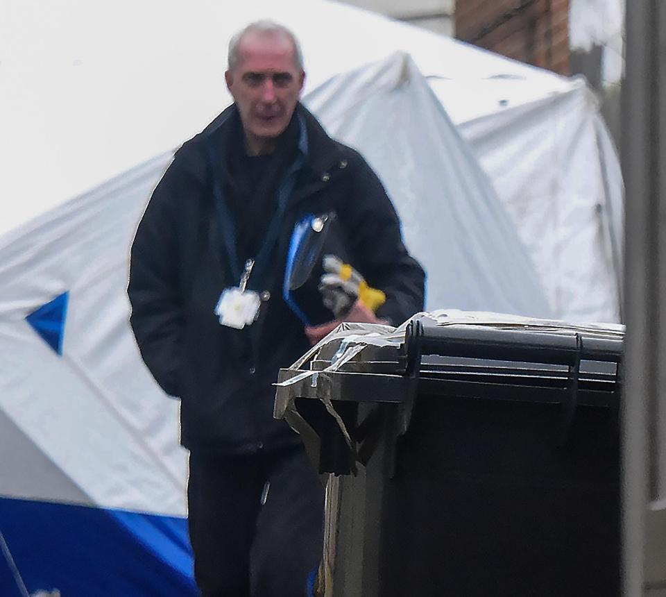 A taped up bin is seen outside one of two properties being excavated by Wiltshire Police