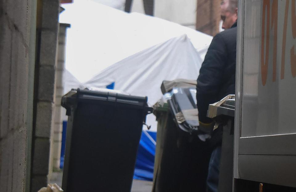 Detectives began searching the property on Monday and today cops could be seen removing Swindon council wheelie bins from the house