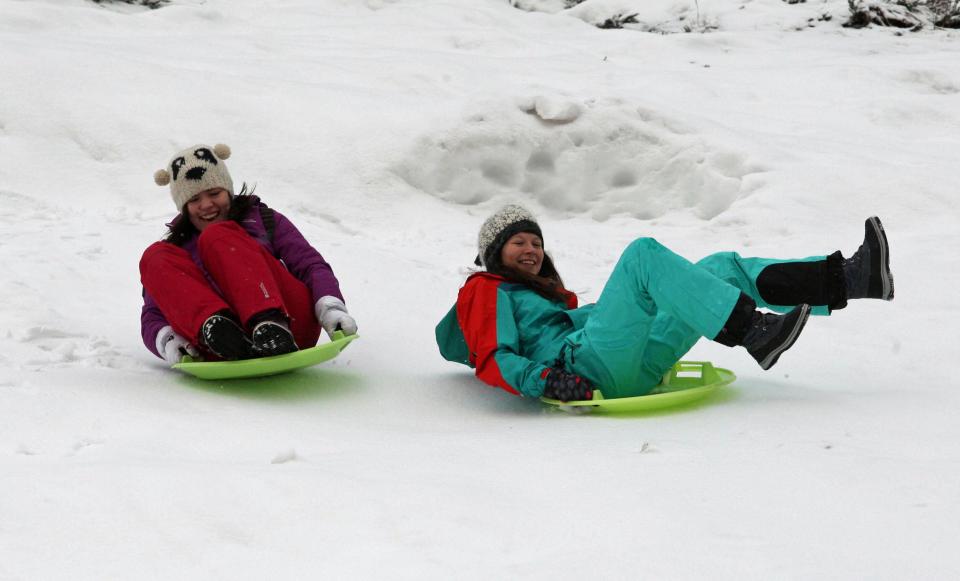  Holidaymakers are making the most of the snowy weather brought in by Storm Doris as they do tobogganing