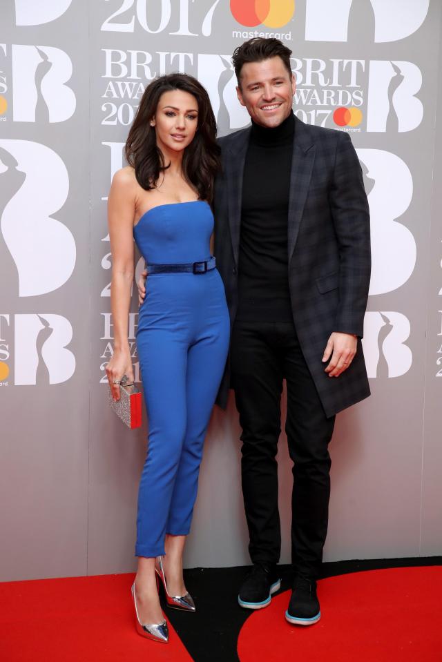  Michelle was seen wearing her contacts on a date at the BRITs with Mark