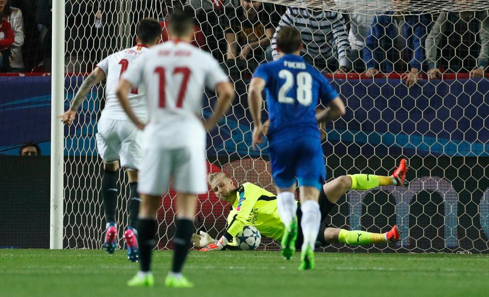 Leicester's Kasper Schmeichel saves a penalty from Sevilla's Joaquin Correa during the first half