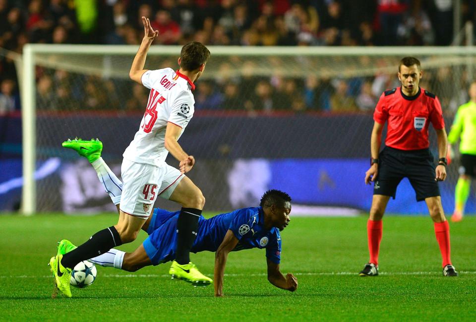 Leicester's Nigerian midfielder Ahmed Musa (down) vies with Sevilla's French defender Clement Lenglet