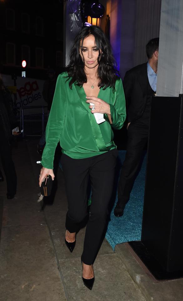  Christine wore an elegant green shirt and smart black trousers