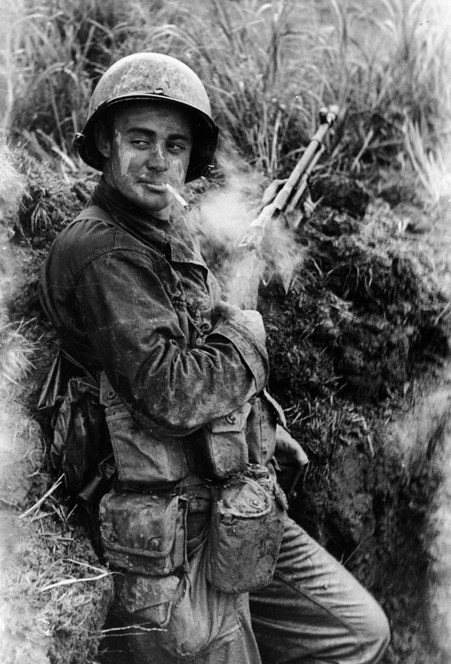  1945: American soldier Terry Moore of F Company smokes a cigarette during posting in Okinawa