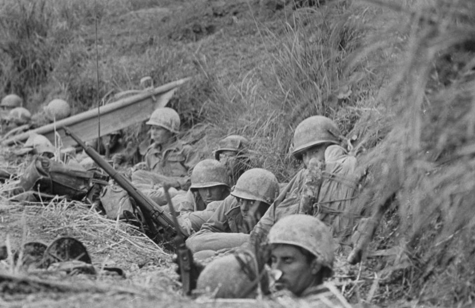  The 7th Infantry Division crouch in a ditch on the first day of battle