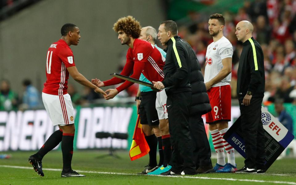 Marouane Fellaini then came onto the field to replace Anthony Martial - and Rooney was told to sit back down