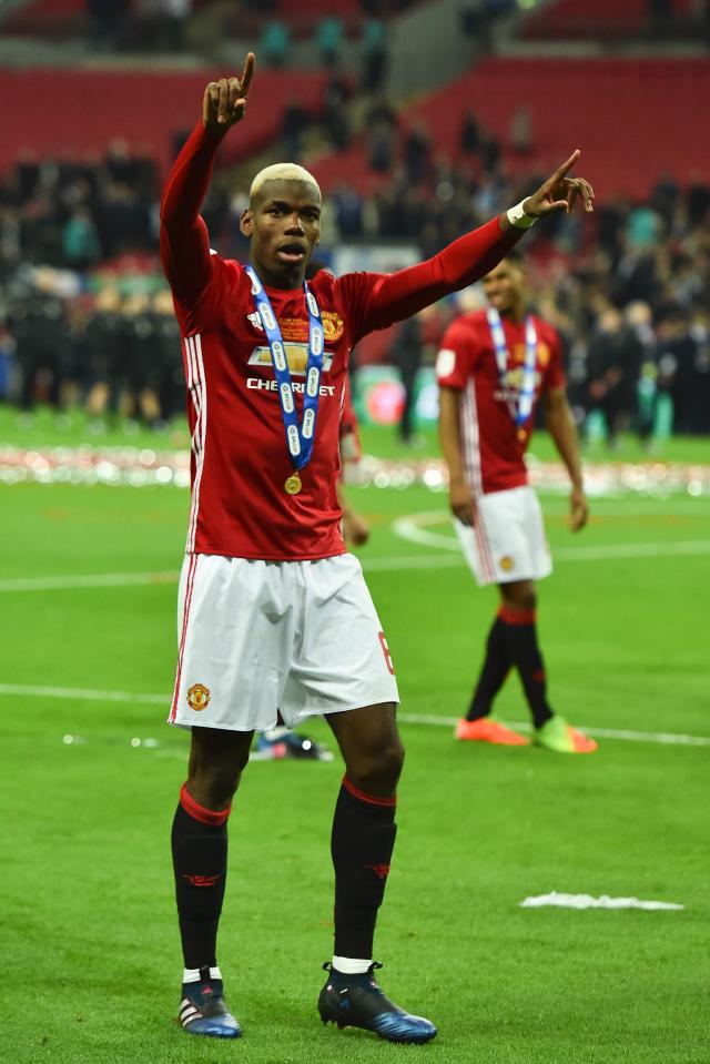  Paul Pogba shows his EFL Cup winners medal after they beat Southampton 3-2 in a dramatic final