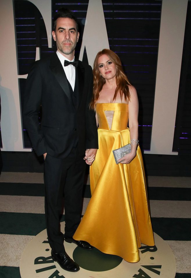  Isla Fisher looked pretty in canary yellow satin as she arrived with husband Sacha Baron Cohen