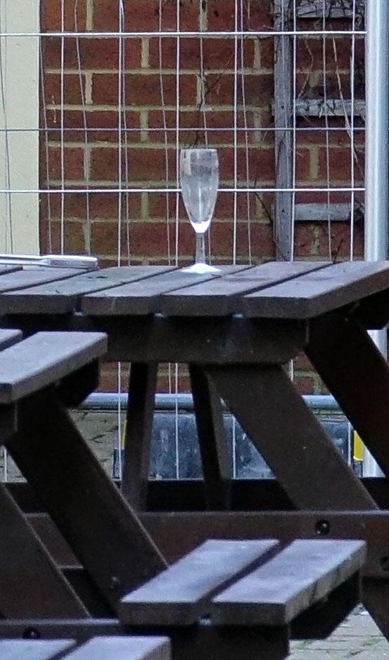  An empty champagne flute remains at the disaster scene