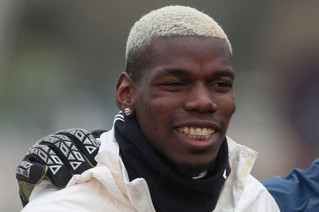 Paul Pogba showed off his new gold braces at Manchester United training