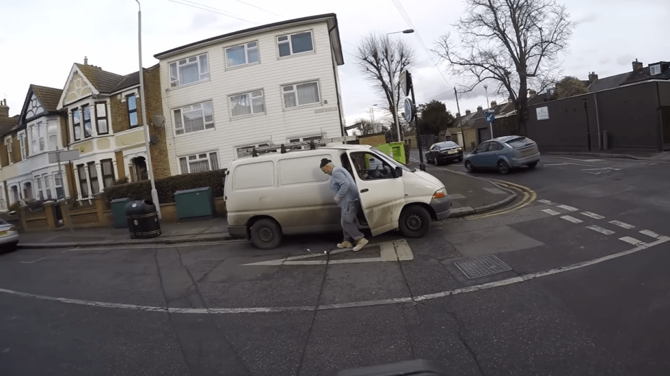  Amazingly, the driver gets out of the car and picks up the litter when challenged by the biker