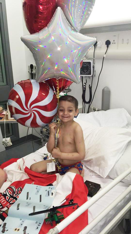  Brave Bradley Lowery beams as he clutches a selection of balloons sent to him by his beloved Sunderland FC