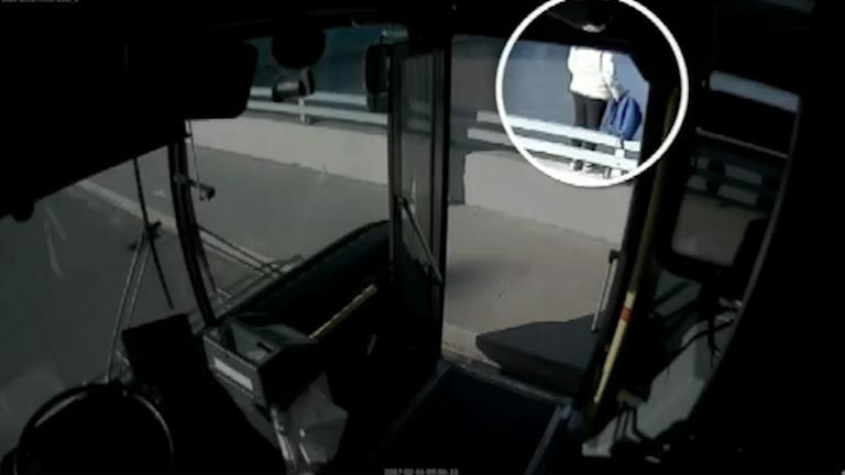  A bus driver was crossing a bridge when he saw a woman getting ready to jump