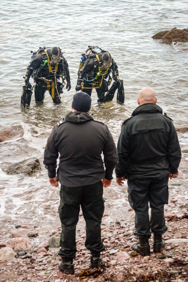  Police divers are seen leaving the water after an unsuccessful search for missing Rose