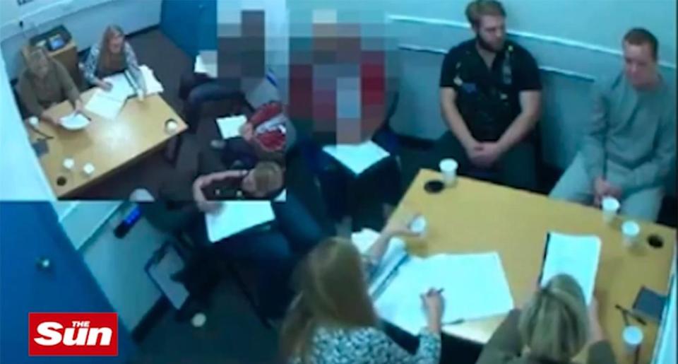 A still from a video shows the killer being interviewed by cops