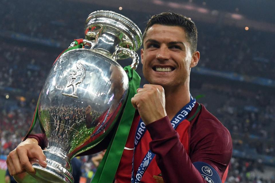  Cristiano Ronaldo with the European Championship trophy last summer