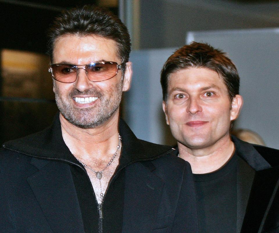  George Michael smiles with former partner Kenny Goss