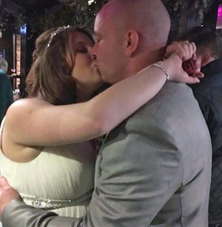  Kissing the bride . . . Couple smooch hours after attack in January