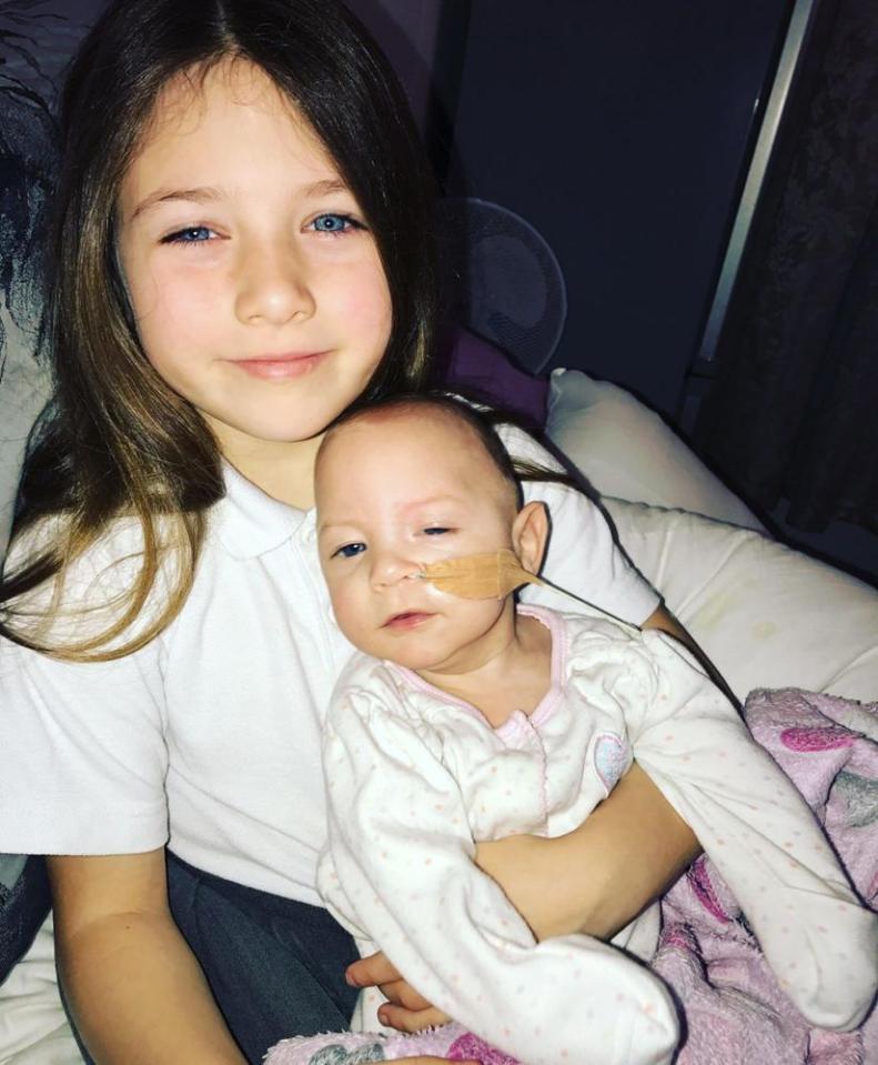 Isabel is happy and loved by her family, including big sister Chloe, now six